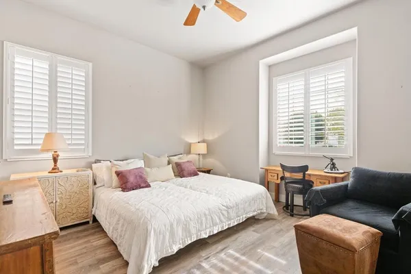 a bedroom with a bed and a couch