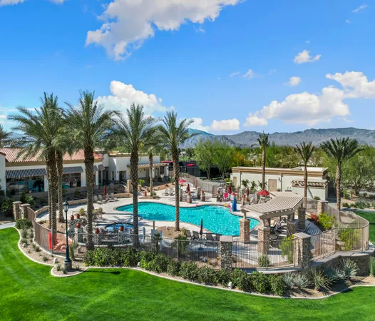 a view of a swimming pool with a yard