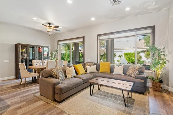 a living room with furniture and a large window