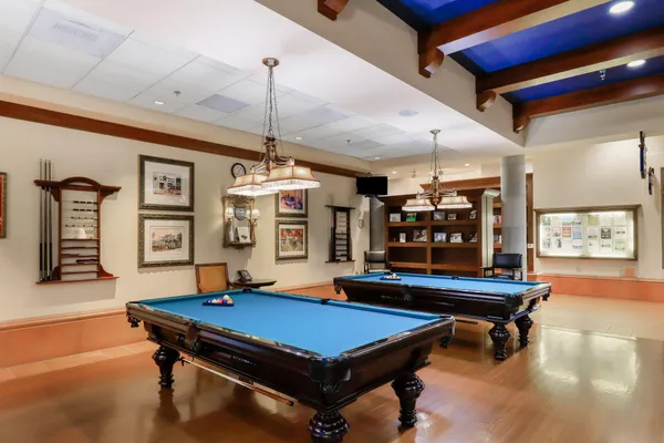 a living room with furniture and large windows