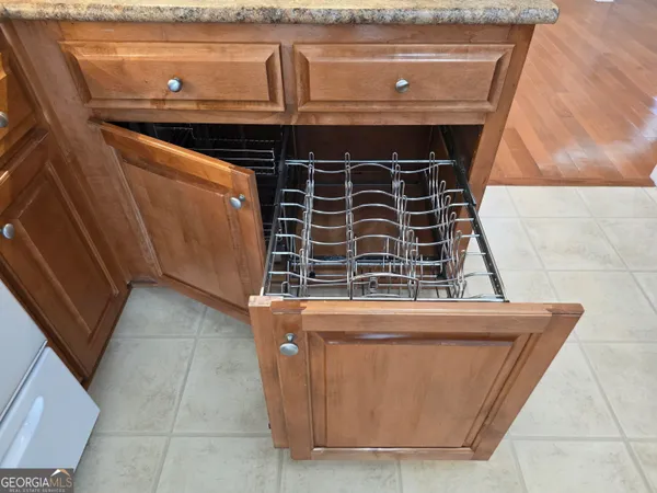a kitchen with stainless steel appliances granite countertop a sink stove refrigerator and cabinets