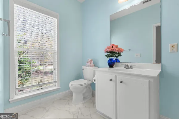 a bathroom with a glass shower door
