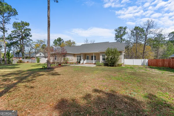 a view of a house with a yard
