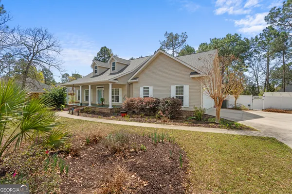 a front view of a house with garden