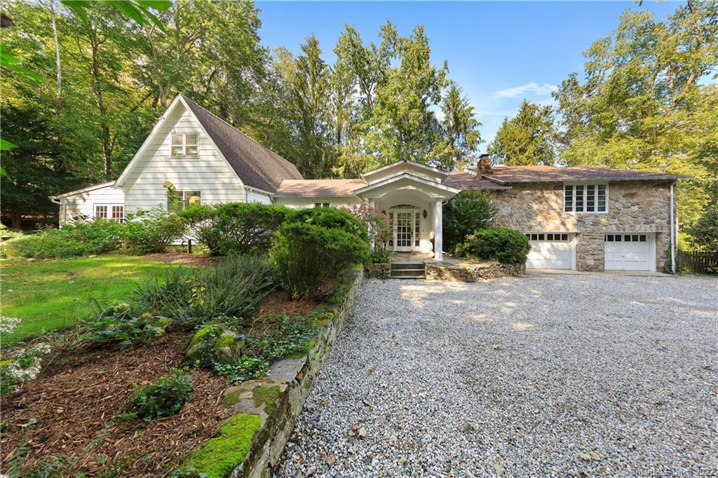 21 Crawford Road Westport, CT 06880 - Photo 1 of 1 a front view of a house with garden