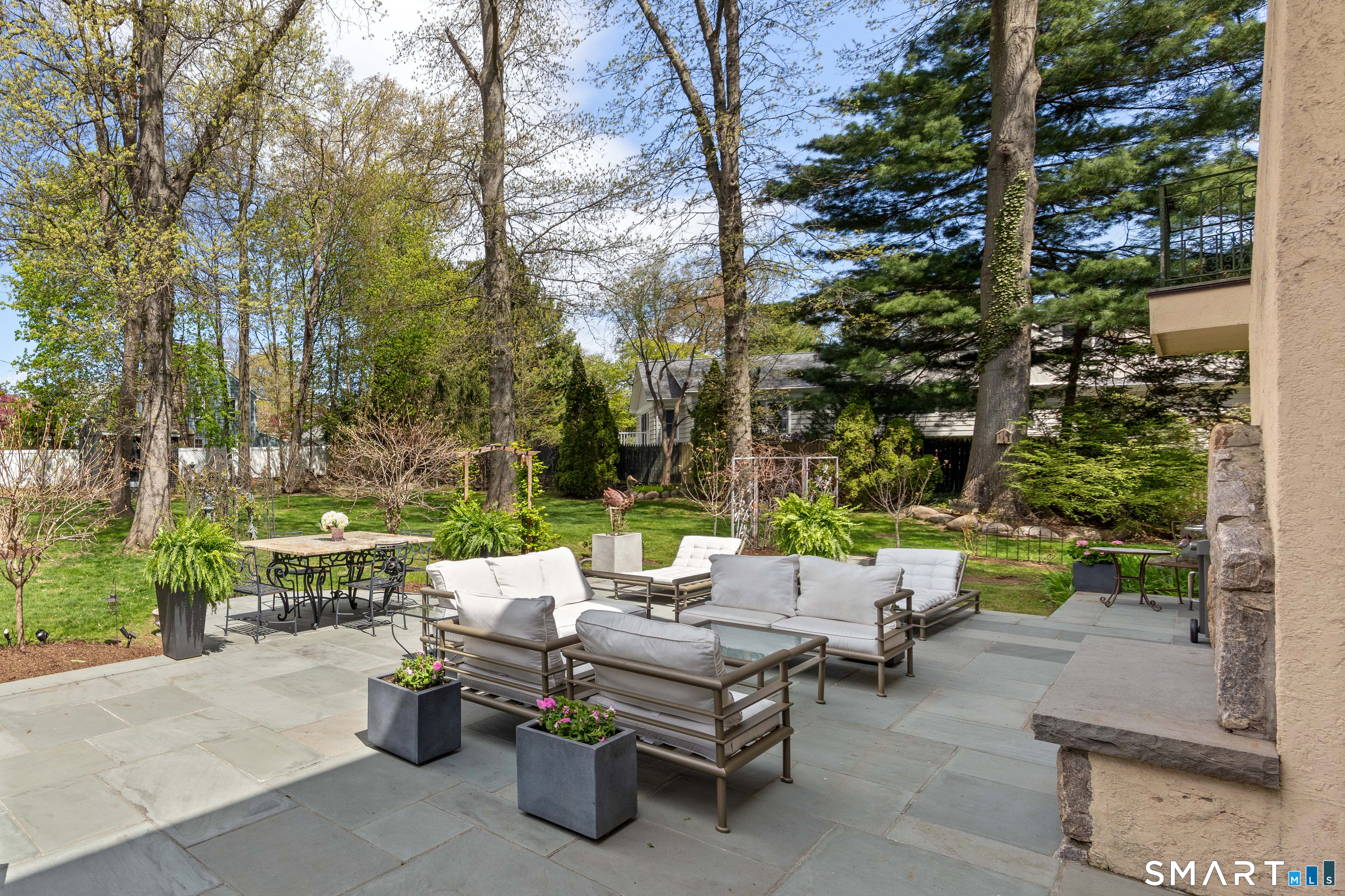 22 Cavray Road Norwalk, CT 06855 - Photo 38 of 40 Back Patio with fireplace and Koi pond