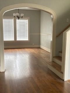a view of a room with wooden floor and window