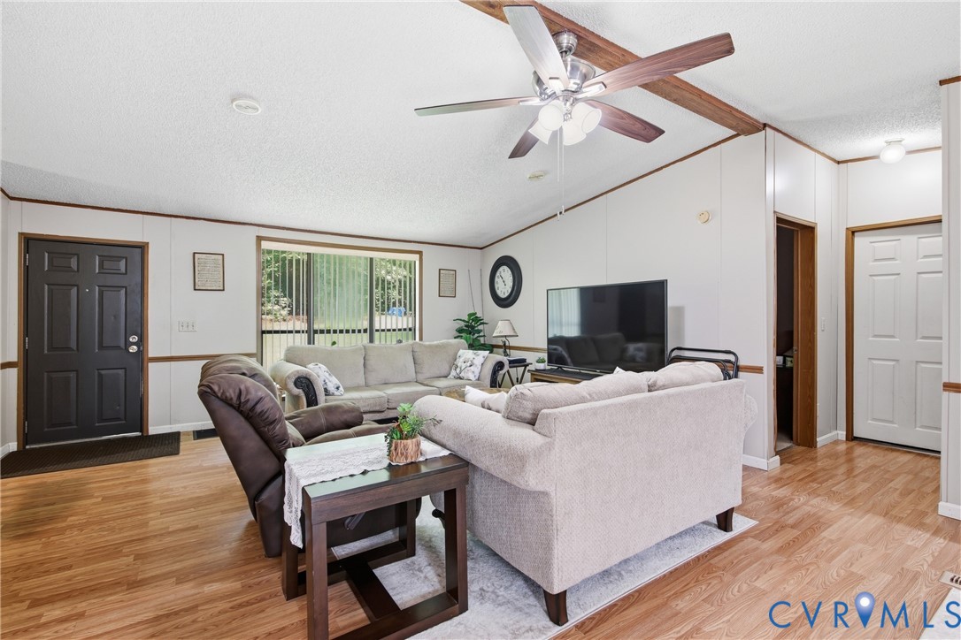 14720 Spring Creek Road Dinwiddie, VA 23841 - Photo 12 of 32 Wood-finish flooring throughout, a vaulted ceiling