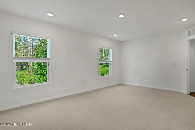 an empty room with windows