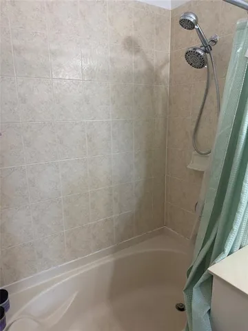 a white toilet sitting next to a small sink