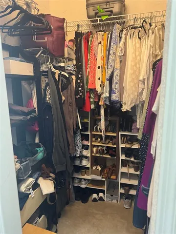 a bedroom with a bed and a mirror