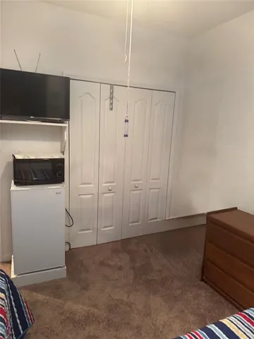 a bathroom with a toilet a sink and a mirror