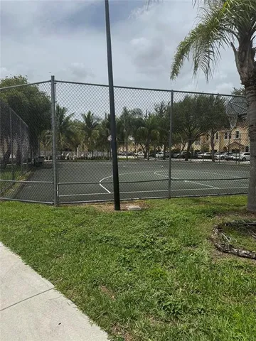 a view of a street with a building in the background