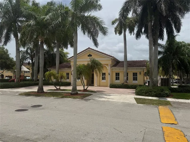 a view of a park with large trees