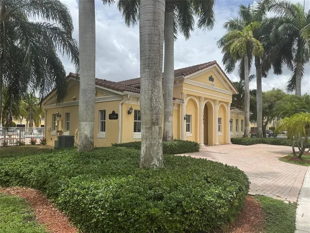 a view of a yard and palm trees