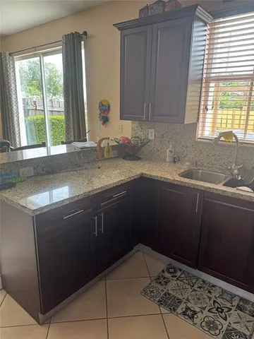 a kitchen with a sink and a window