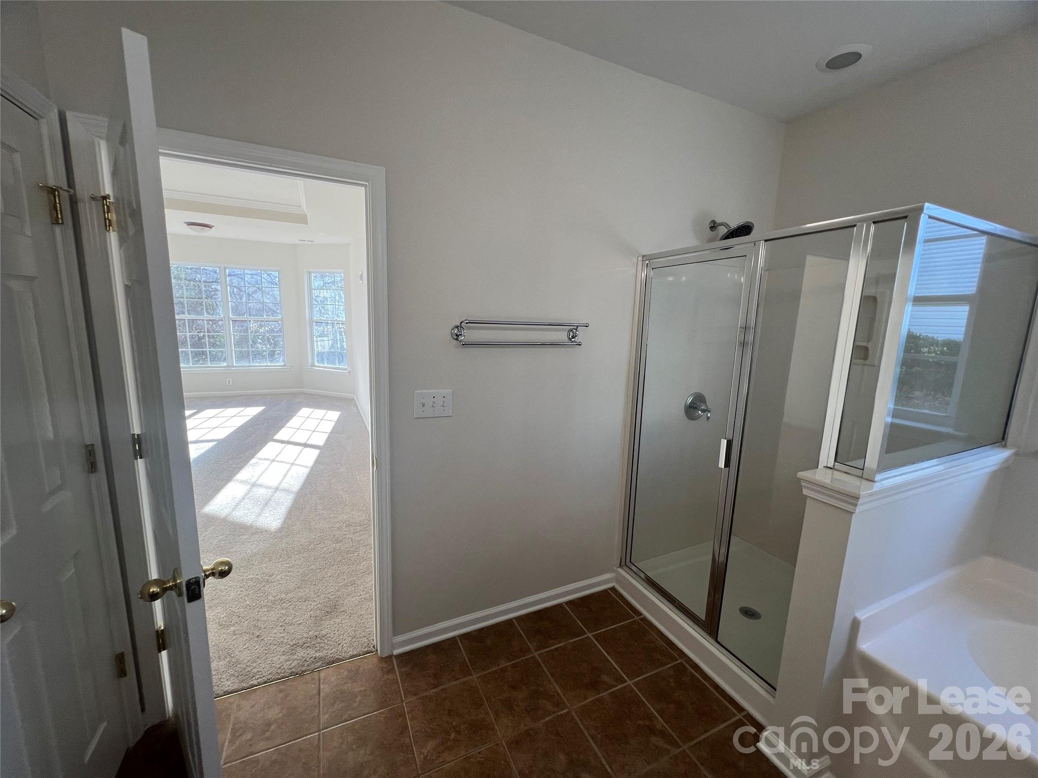 5002 Fine Robe Drive Indian Trail, NC 28079 - Photo 18 of 25 a bathroom with a shower and a toilet