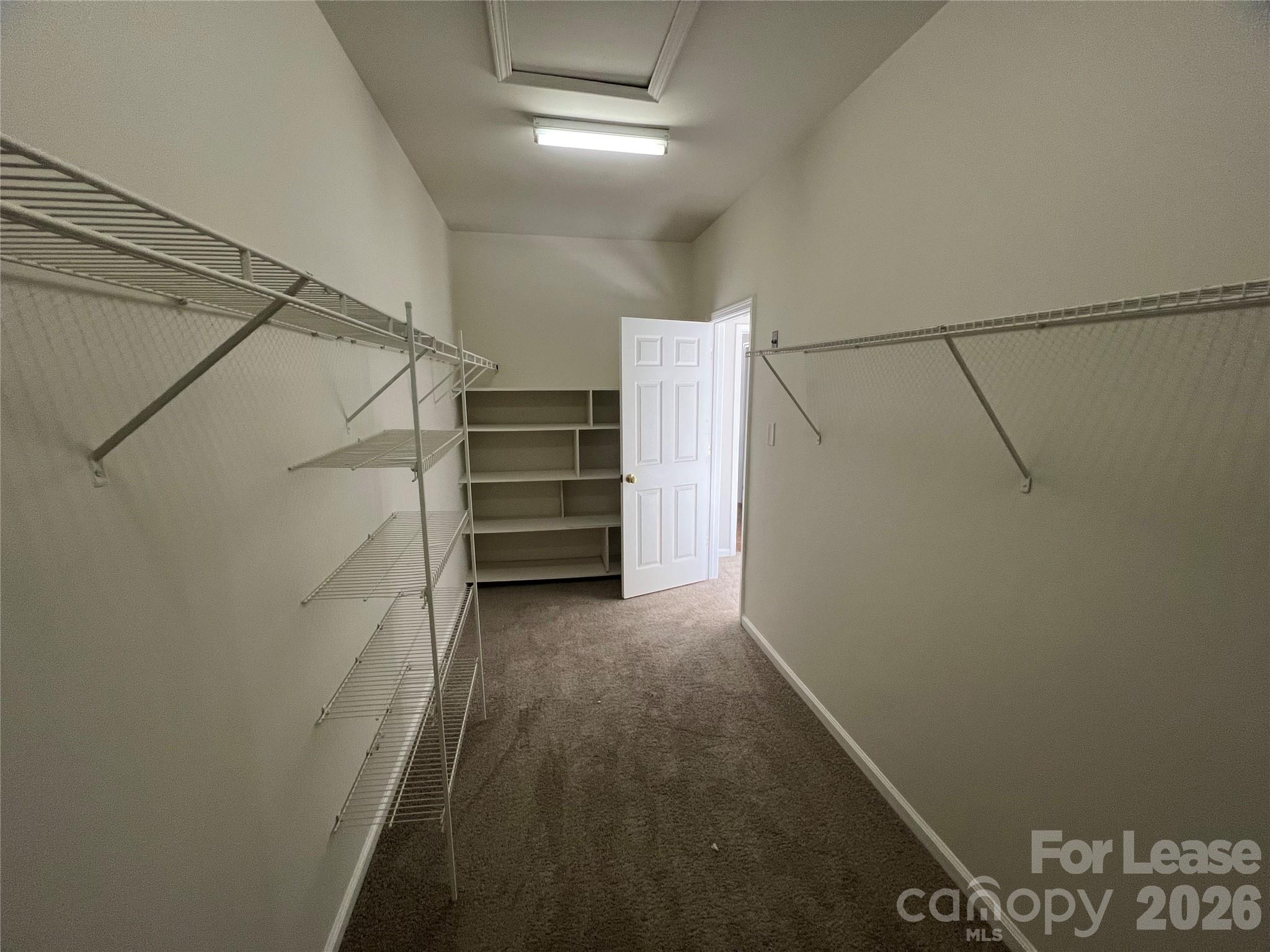 5002 Fine Robe Drive Indian Trail, NC 28079 - Photo 20 of 25 a view of walk in closet with empty racks