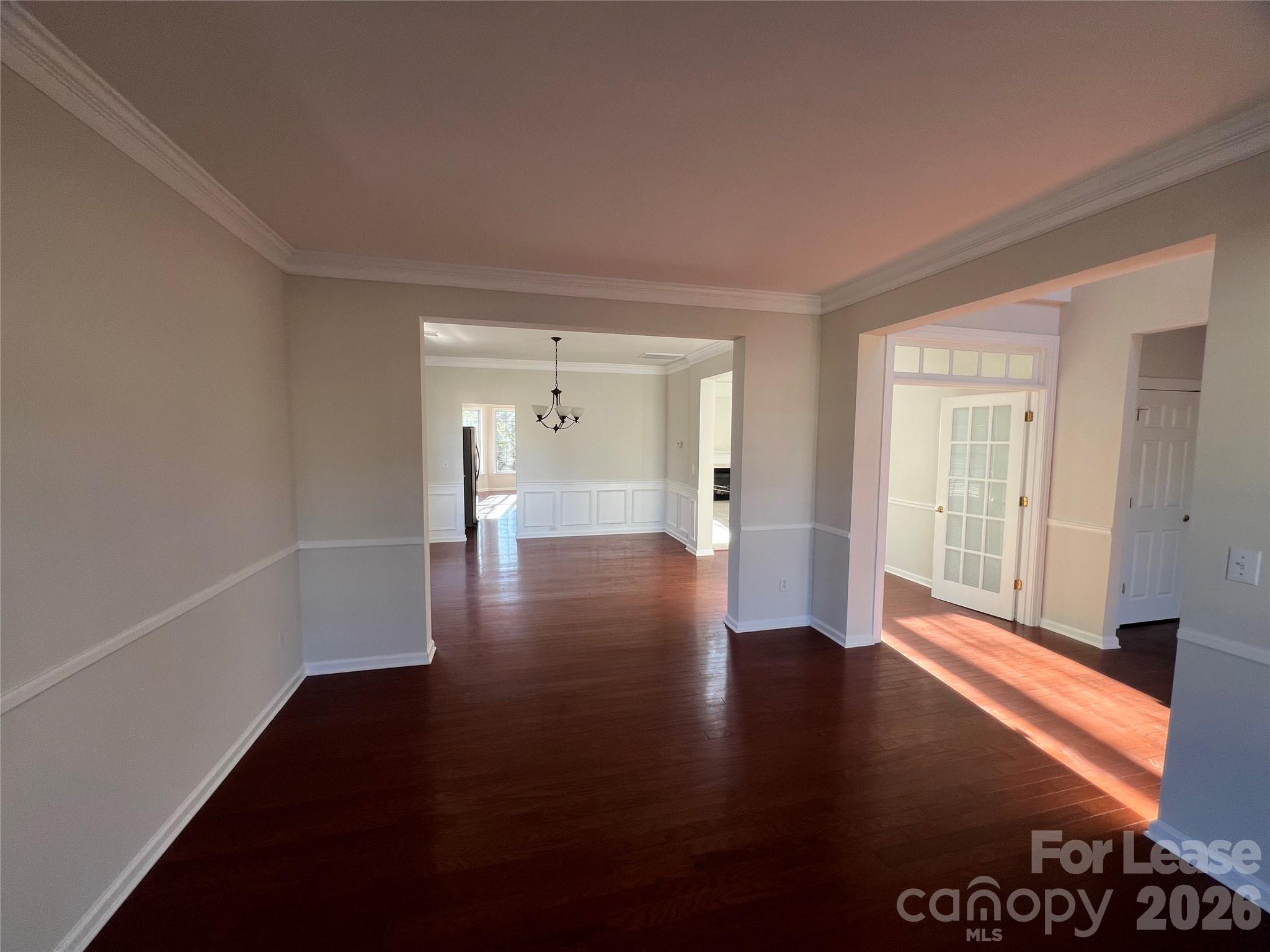 5002 Fine Robe Drive Indian Trail, NC 28079 - Photo 4 of 25 a view of a room with wooden floor and a window