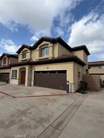 a front view of a house with a garage