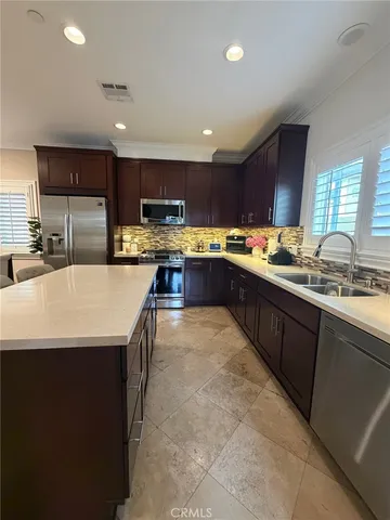 a kitchen with lots of counter top space sink and appliances