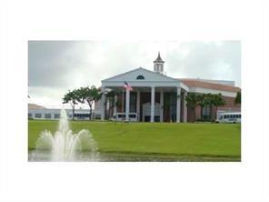West Deerfield Beach Deerfield Beach, FL 33442 - Photo 8 of 22 a front view of a house with a garden
