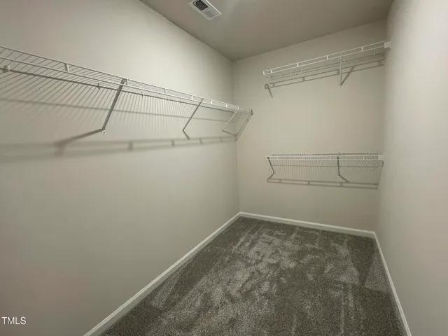 a view of a room with racks on the wall