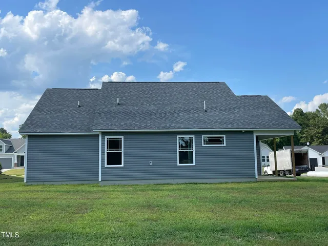 a brick house with a yard