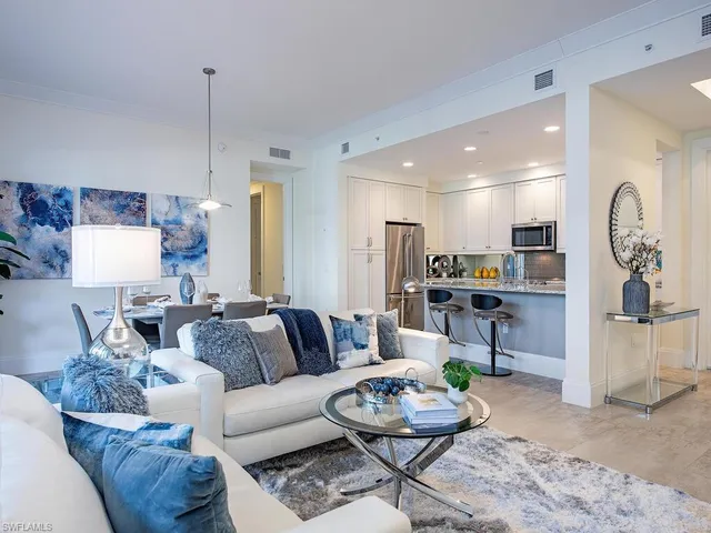 a view of a dining room with furniture large windows and wooden floor