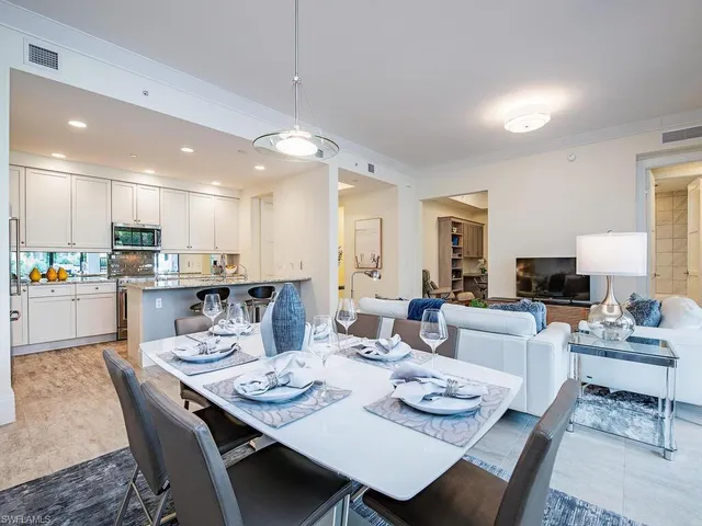 a bedroom with bed and wooden floor