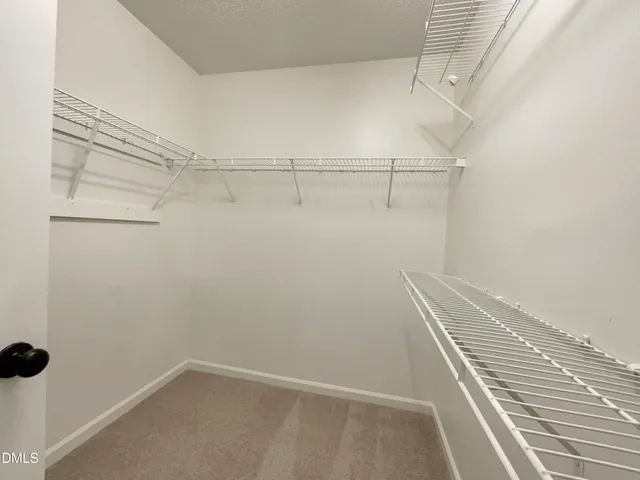 a view of a room with racks on the wall