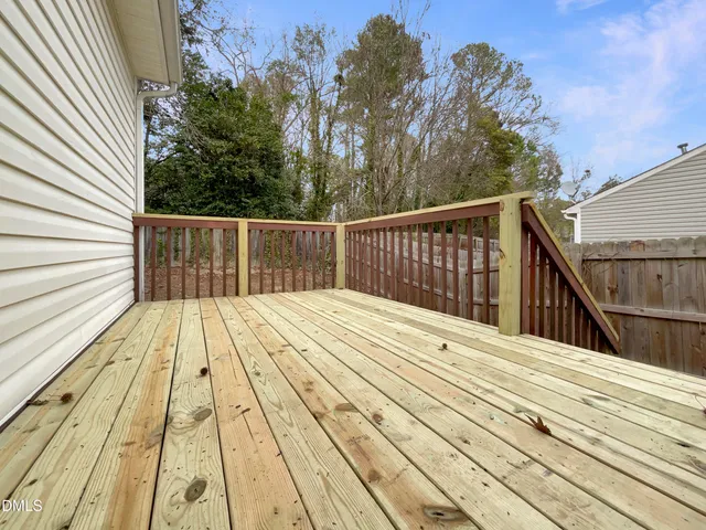 a view of balcony and wooden floor
