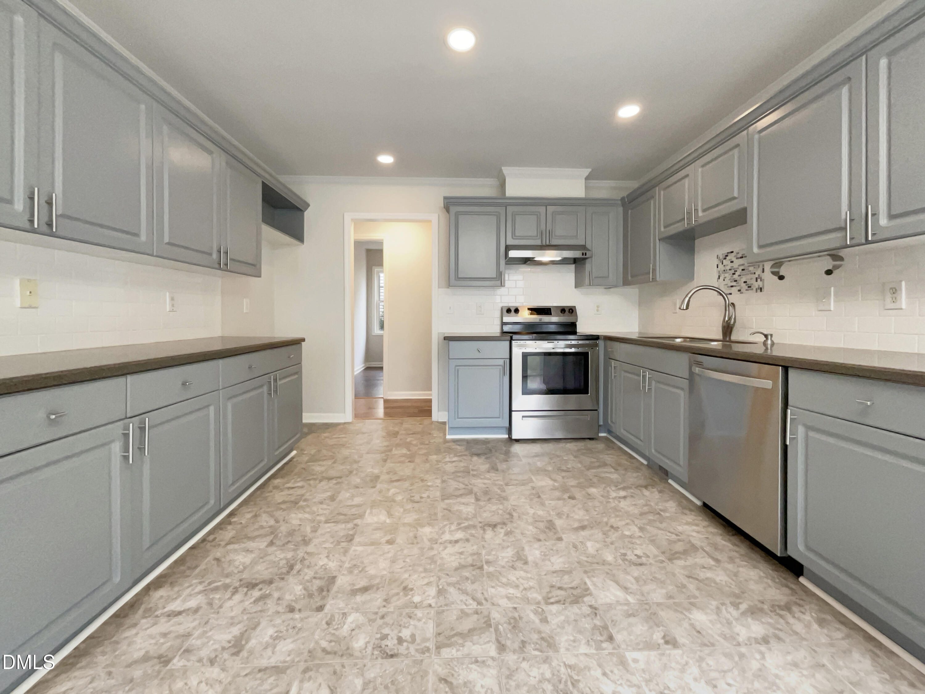 3501 Streams Of Fields Drive Raleigh, NC 27604 - Photo 2 of 16 a kitchen with stainless steel appliances granite countertop a sink and cabinets