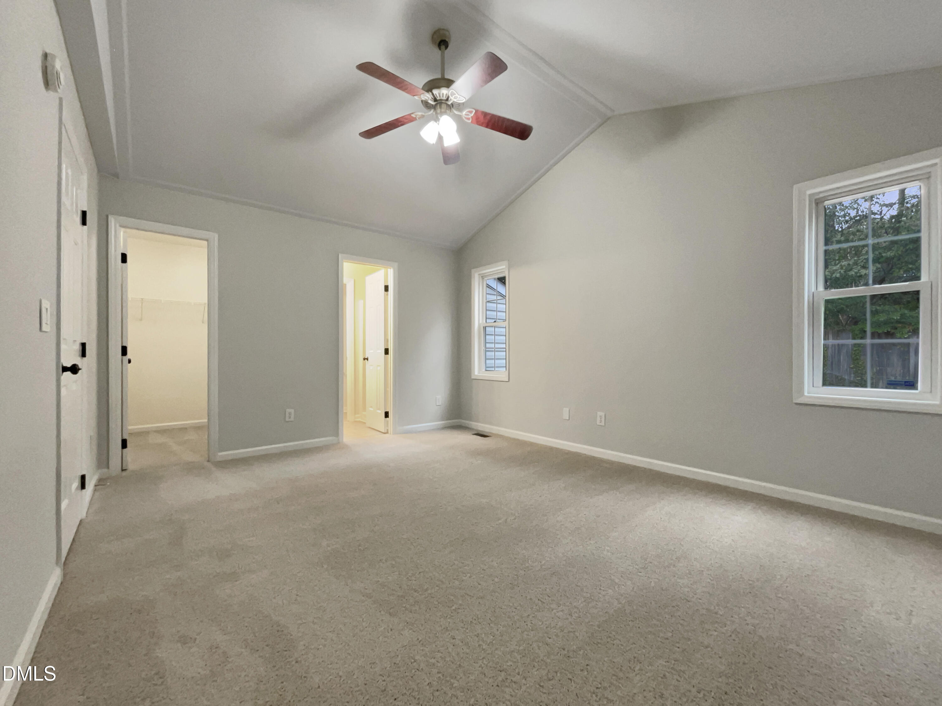 3501 Streams Of Fields Drive Raleigh, NC 27604 - Photo 4 of 16 an empty room with chandelier fan and windows