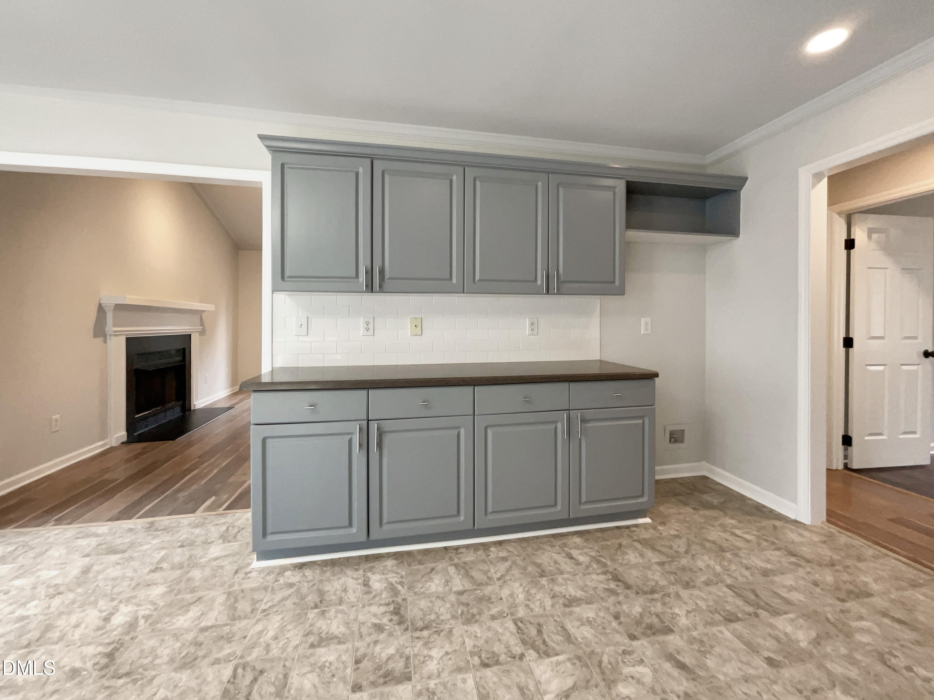 3501 Streams Of Fields Drive Raleigh, NC 27604 - Photo 9 of 16 a view of kitchen with cabinets and fireplace