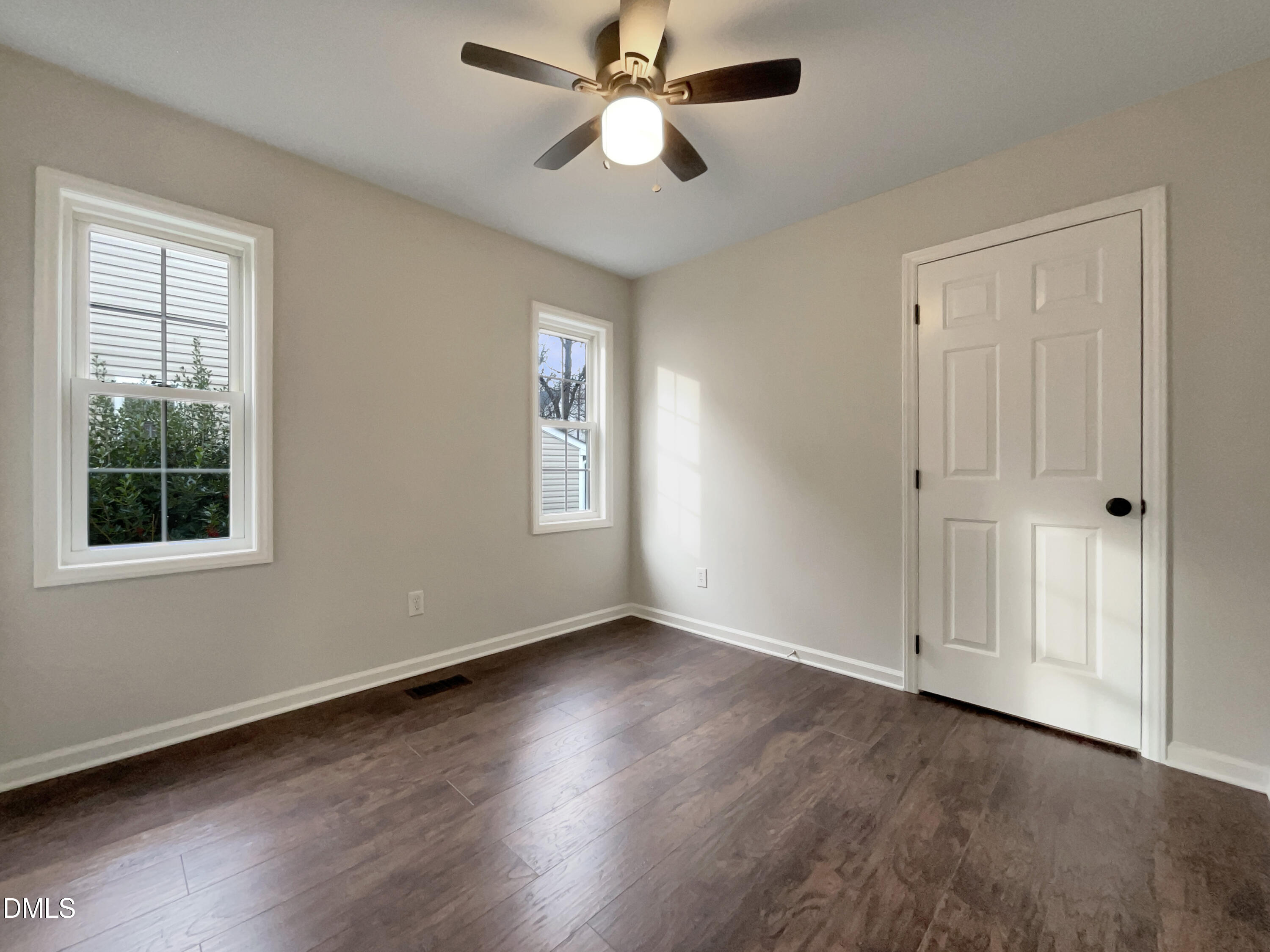 3501 Streams Of Fields Drive Raleigh, NC 27604 - Photo 10 of 16 a view of an empty room with wooden floor and a window