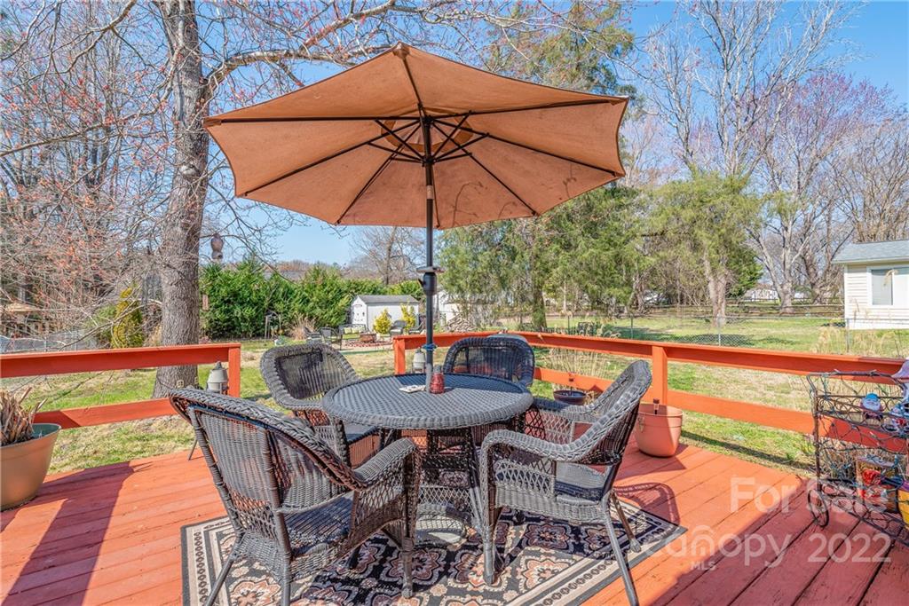 1531 Crestdale Road Rock Hill, SC 29732 - Photo 17 of 20 an outdoor sitting area with furniture and umbrella