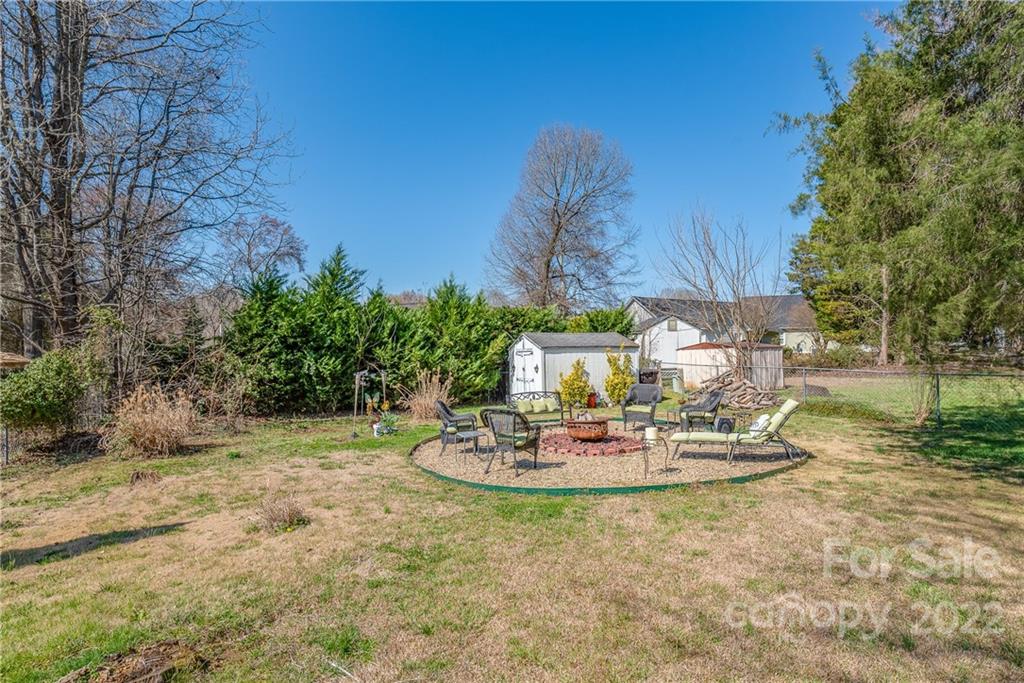 1531 Crestdale Road Rock Hill, SC 29732 - Photo 19 of 20 a table and chairs in a garden