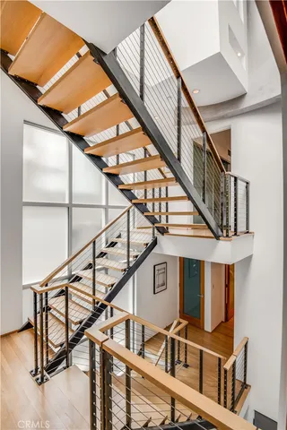 a bathroom with a glass shower door and a window
