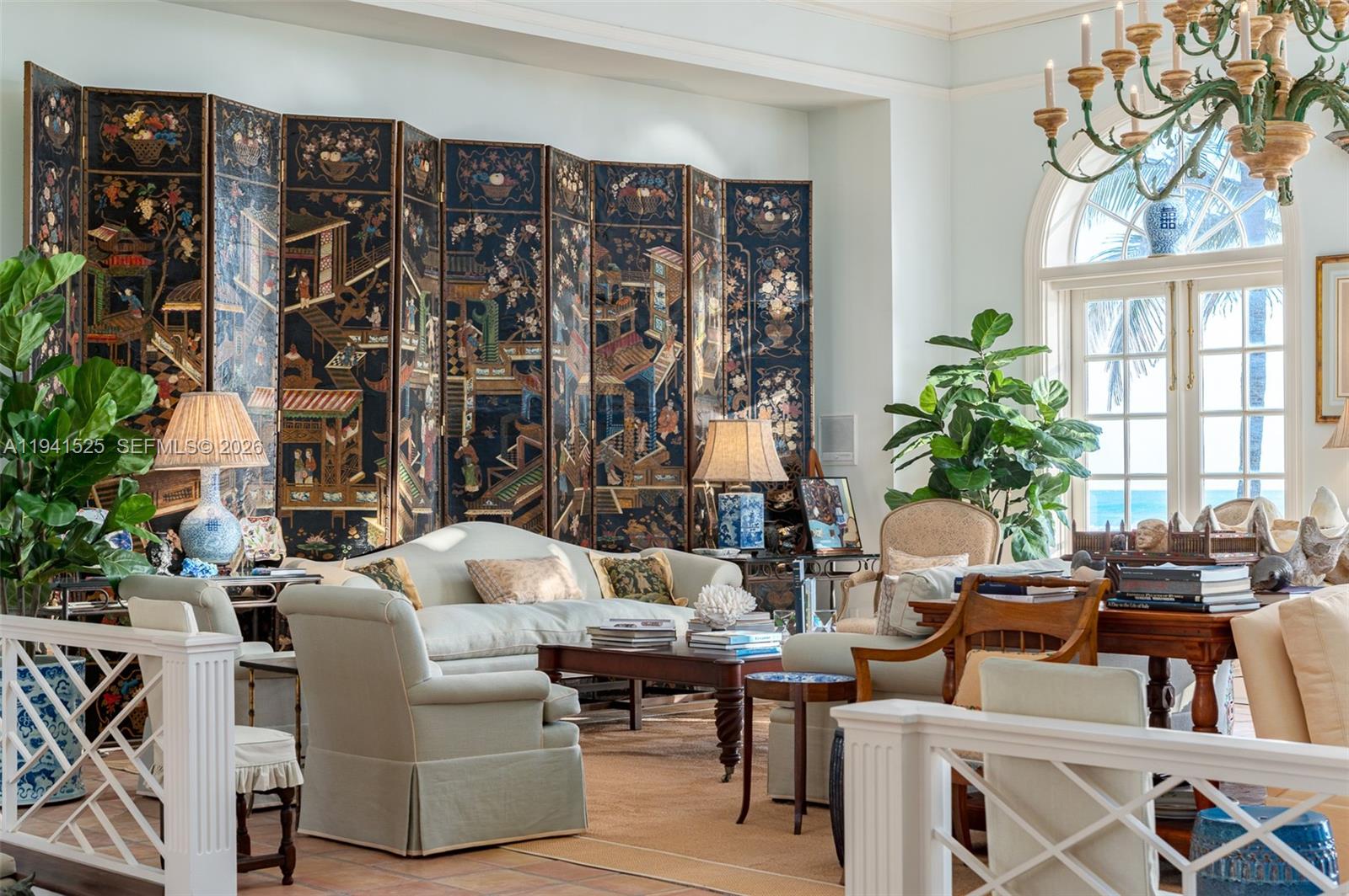 21 South Beach Road Jupiter Island, FL 33455 - Photo 15 of 45 a living room with patio furniture and a large window