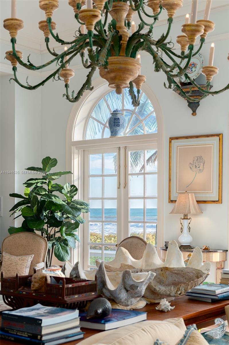 21 South Beach Road Jupiter Island, FL 33455 - Photo 17 of 45 a table with a vase of flowers sitting on a table