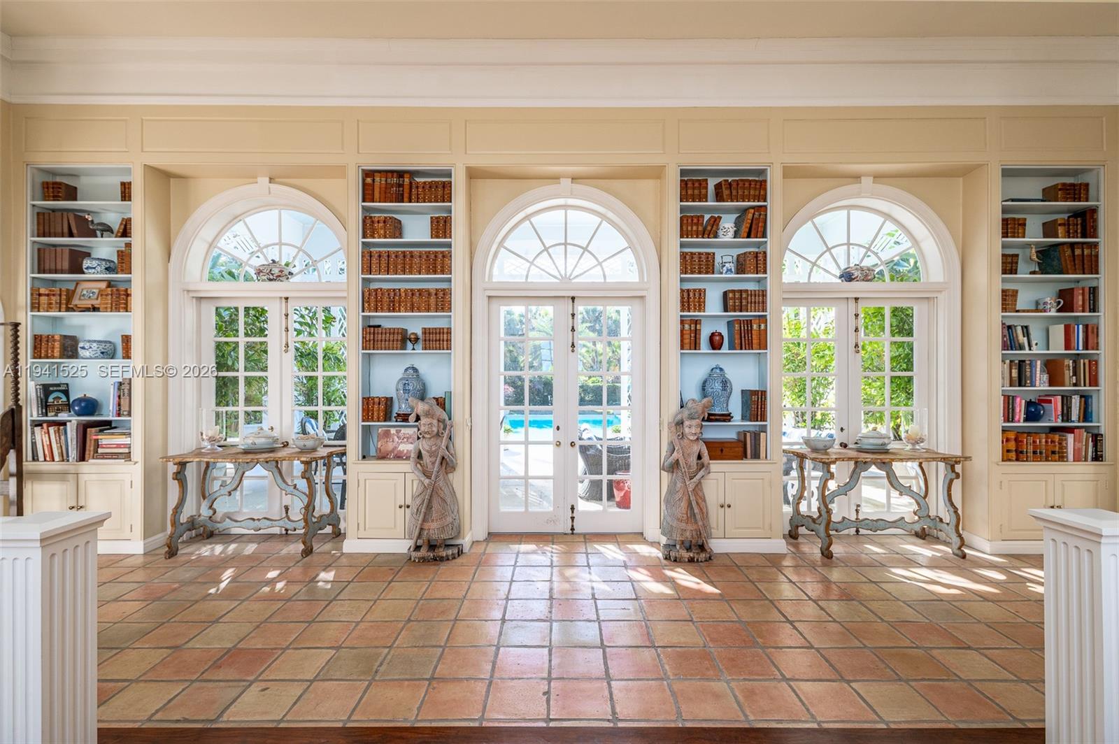 21 South Beach Road Jupiter Island, FL 33455 - Photo 18 of 45 a living room with fireplace furniture and a large window