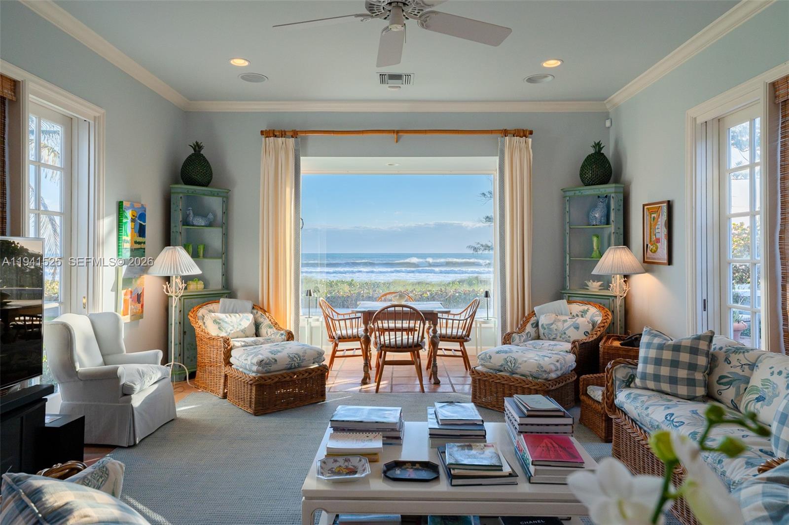 21 South Beach Road Jupiter Island, FL 33455 - Photo 22 of 45 a living room with furniture and a fireplace