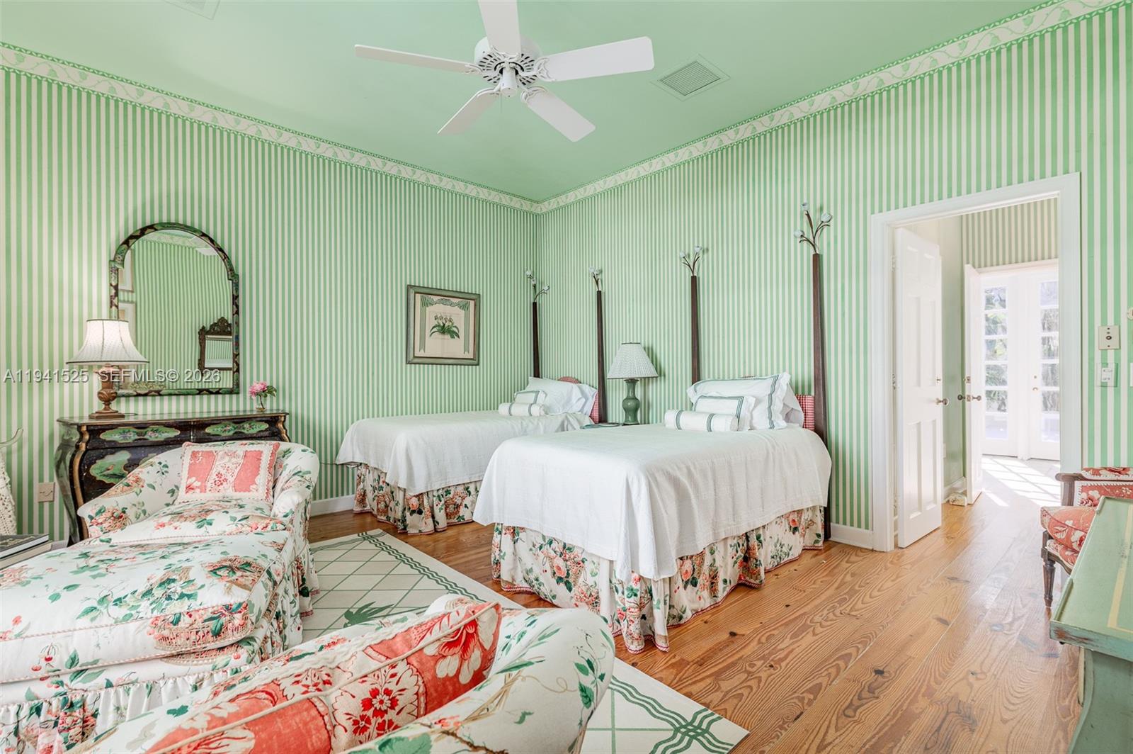 21 South Beach Road Jupiter Island, FL 33455 - Photo 26 of 45 a bedroom with bed and wooden floor