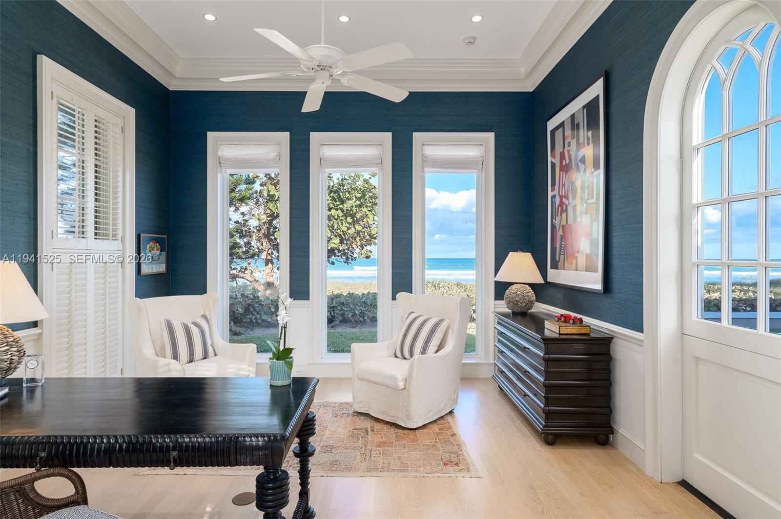 21 South Beach Road Jupiter Island, FL 33455 - Photo 28 of 45 a living room with furniture and a large window