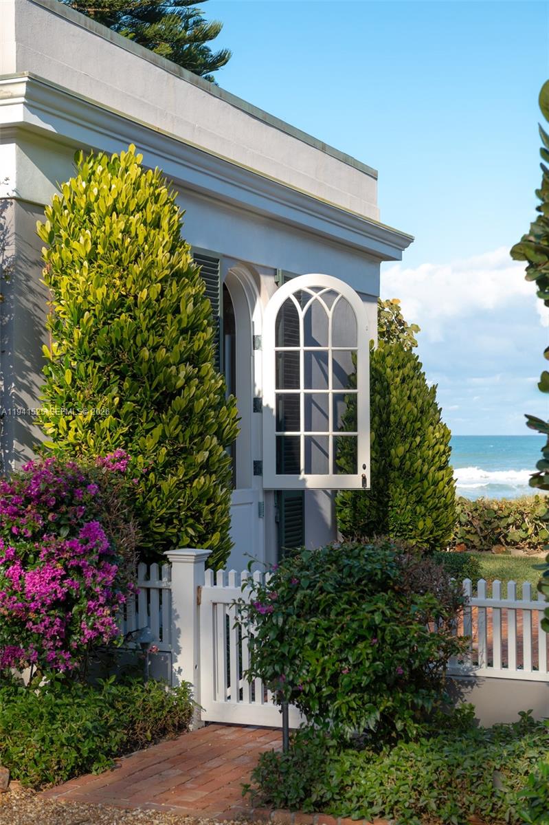 21 South Beach Road Jupiter Island, FL 33455 - Photo 29 of 45 a front view of a house with a yard