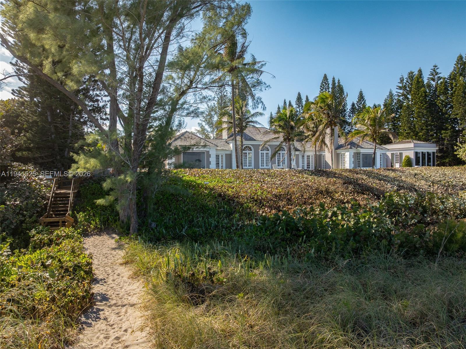 21 South Beach Road Jupiter Island, FL 33455 - Photo 32 of 45 a view of backyard with green space