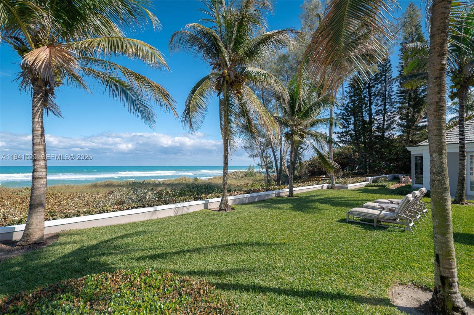 21 South Beach Road Jupiter Island, FL 33455 - Photo 38 of 45 a view of a park with swings and palm trees