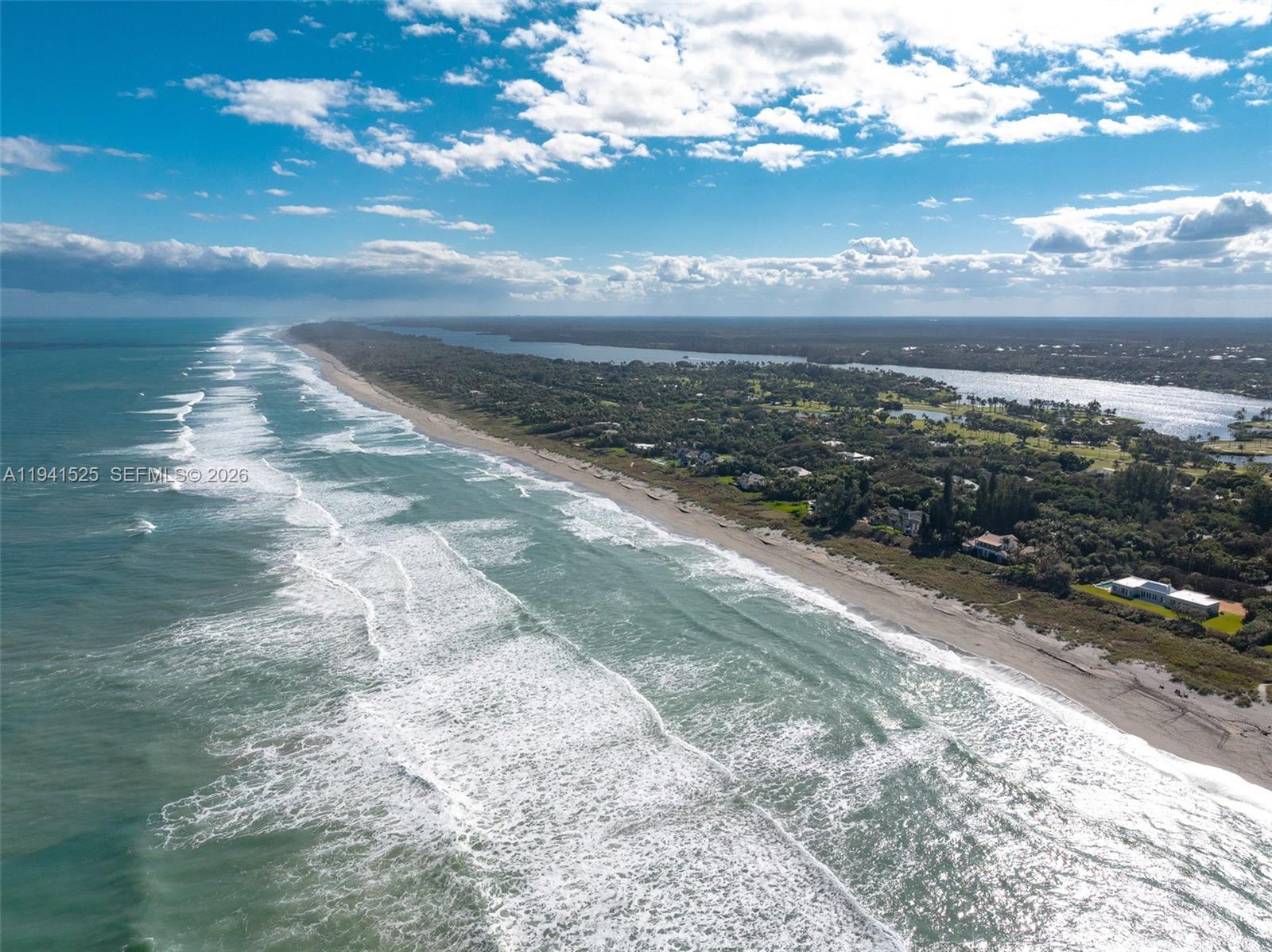 21 South Beach Road Jupiter Island, FL 33455 - Photo 44 of 45 a view of a lake with a beach