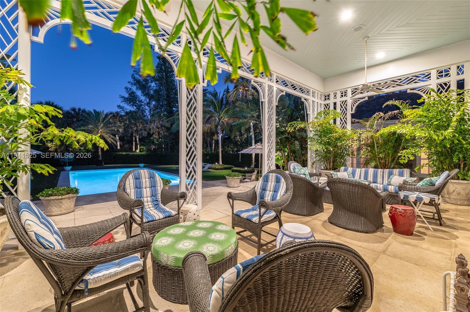 21 South Beach Road Jupiter Island, FL 33455 - Photo 6 of 45 a view of a chairs and table in patio